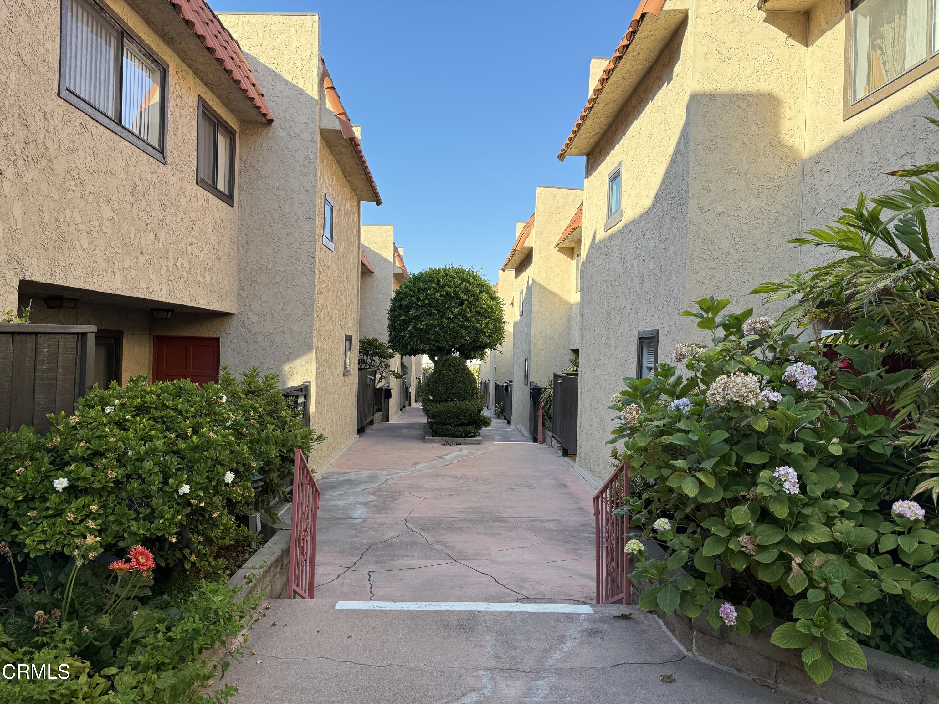 108 North Chapel Avenue, Unit 5 Alhambra, CA 91801 - Photo 28 of 30 a front view of a house with a yard