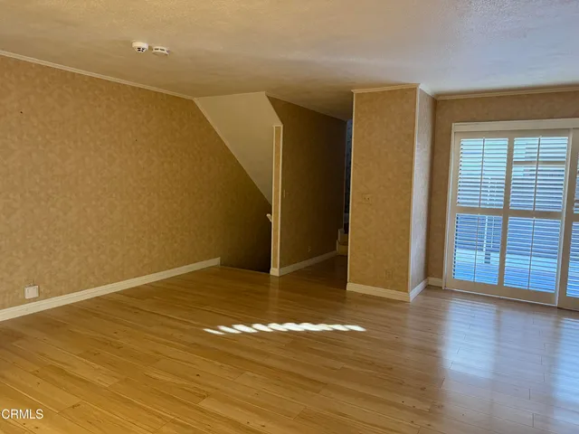 a kitchen with cabinets stainless steel appliances and a sink