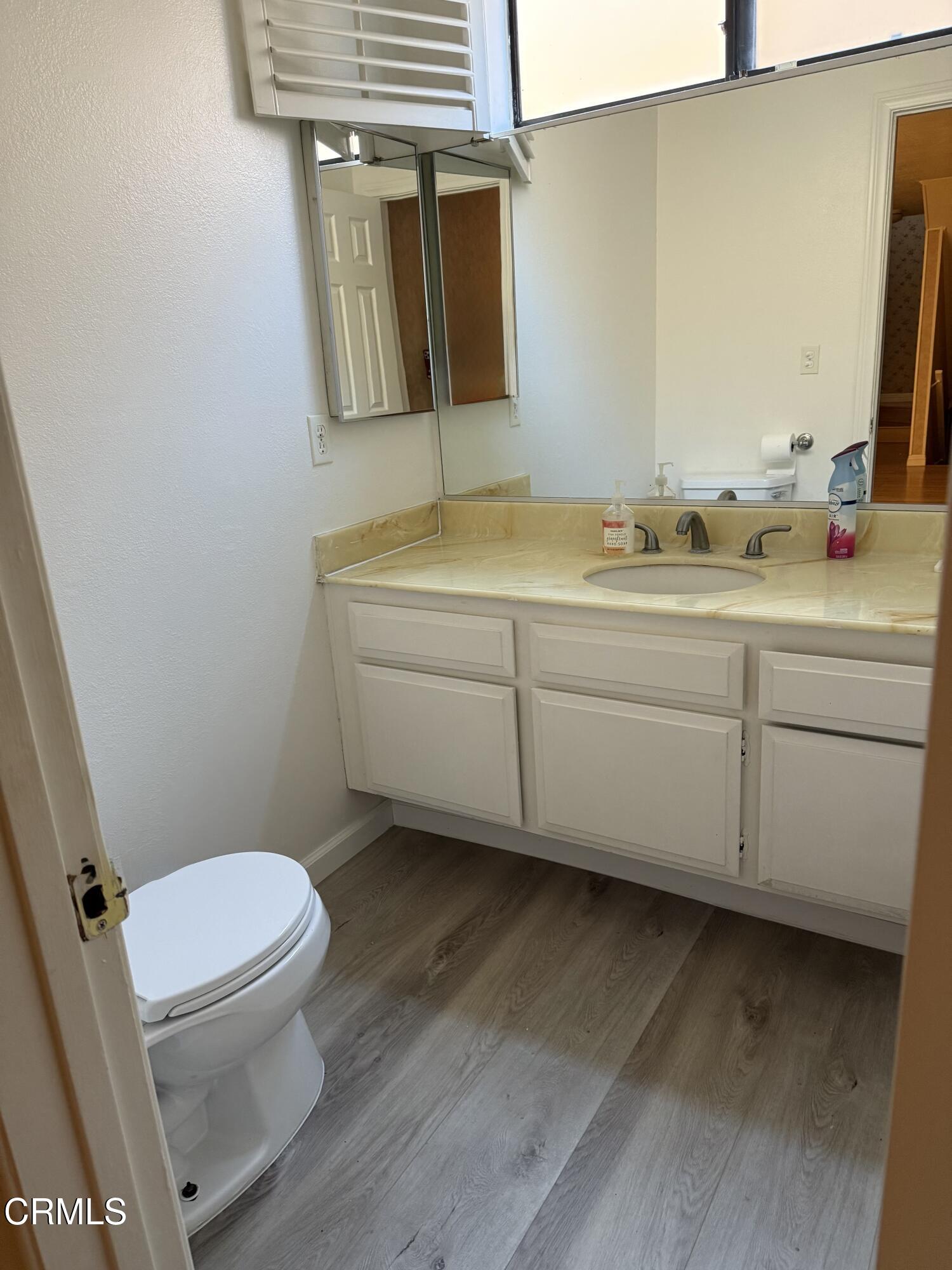108 North Chapel Avenue, Unit 5 Alhambra, CA 91801 - Photo 10 of 30 a bathroom with a toilet a sink and mirror