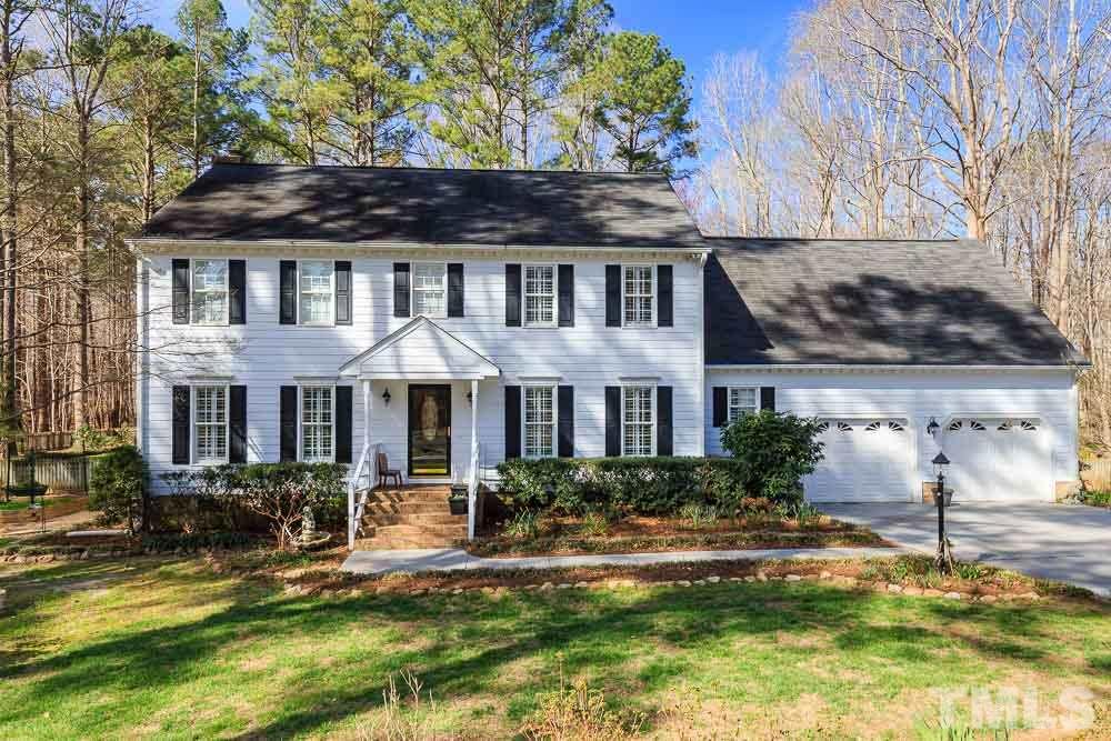 11905 Old Creedmoor Road Raleigh, NC 27613 - Photo 1 of 24 a front view of house with yard and outdoor seating