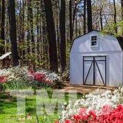 11905 Old Creedmoor Road Raleigh, NC 27613 - Photo 24 of 24 a front view of a house with garden