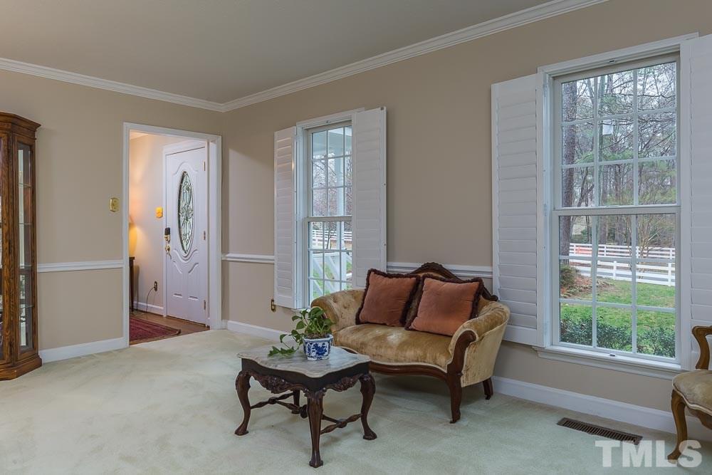 11905 Old Creedmoor Road Raleigh, NC 27613 - Photo 6 of 24 a living room with furniture and a window