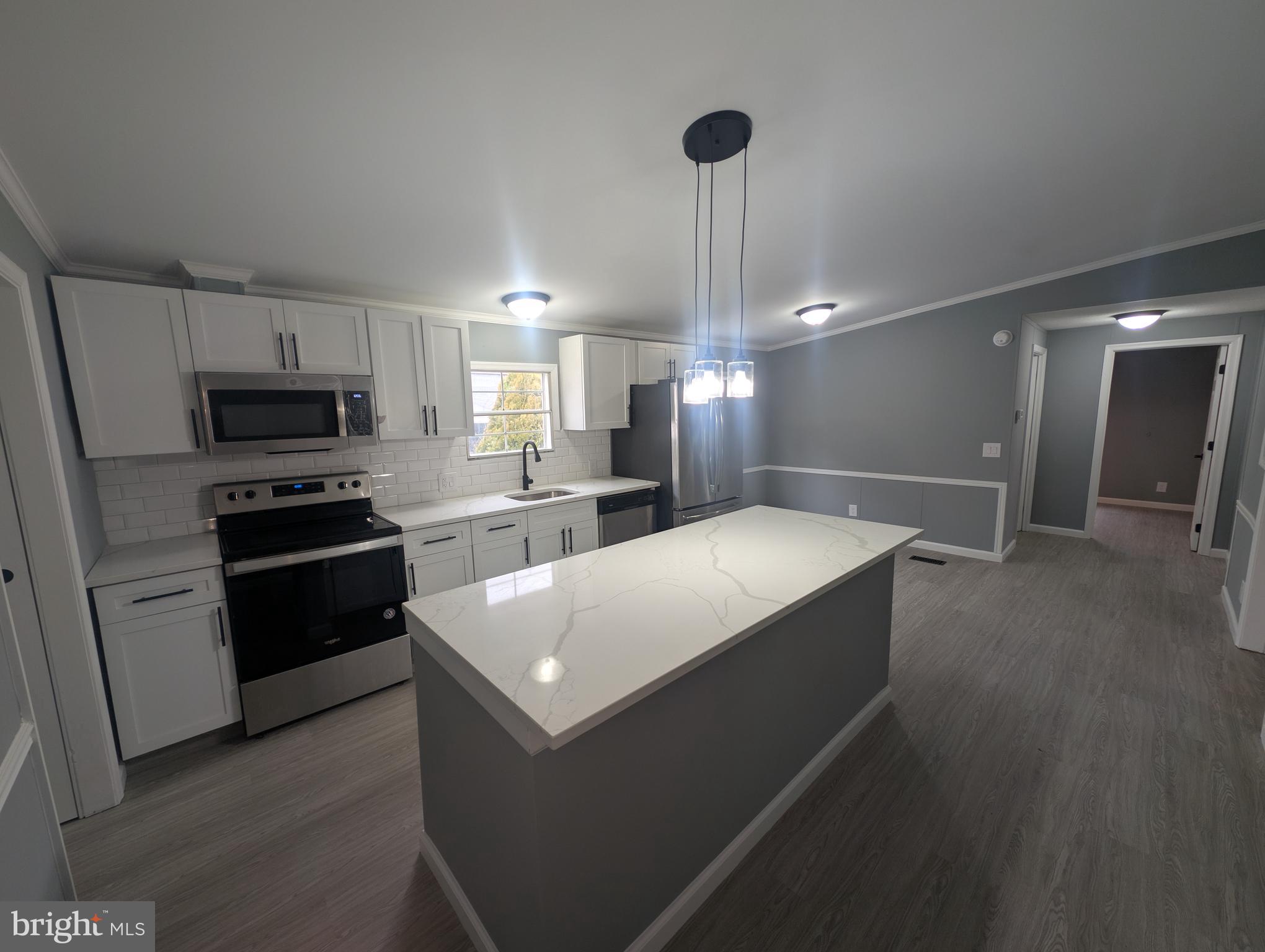 1926 Fletcher Road Aberdeen, MD 21001 - Photo 1 of 15 a kitchen with a refrigerator and a sink