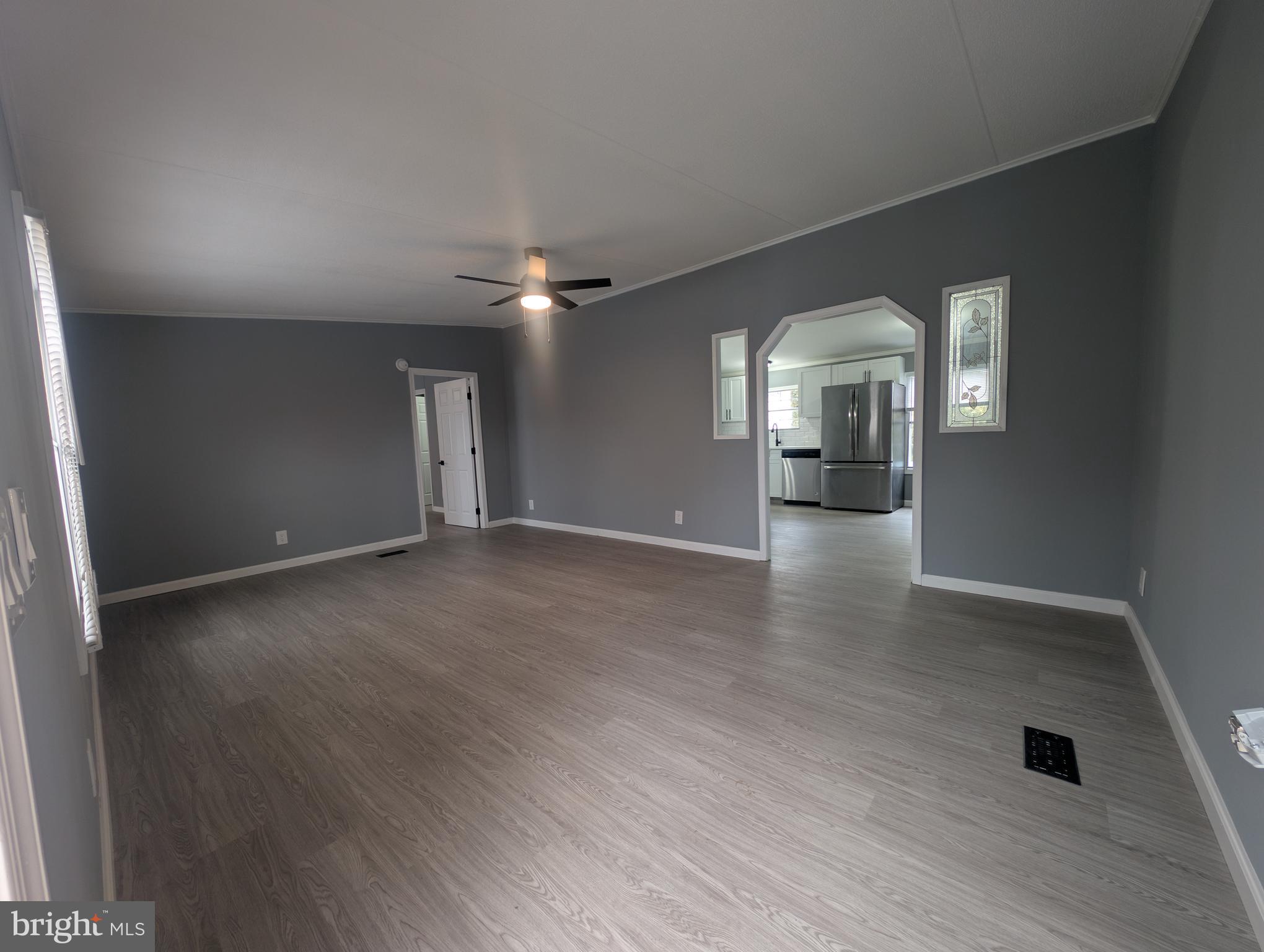 1926 Fletcher Road Aberdeen, MD 21001 - Photo 4 of 15 an empty room with wooden floor and windows