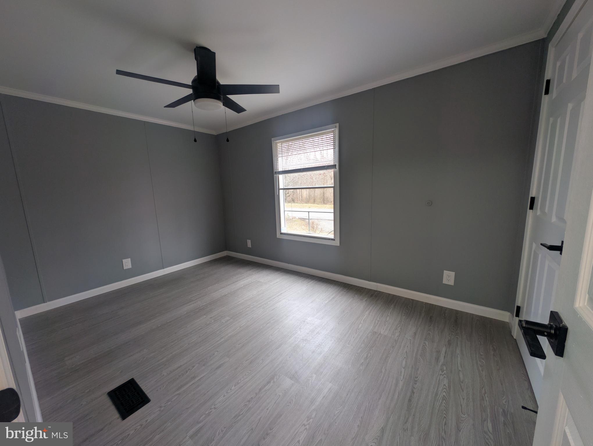 1926 Fletcher Road Aberdeen, MD 21001 - Photo 8 of 15 wooden floor in an empty room with a window