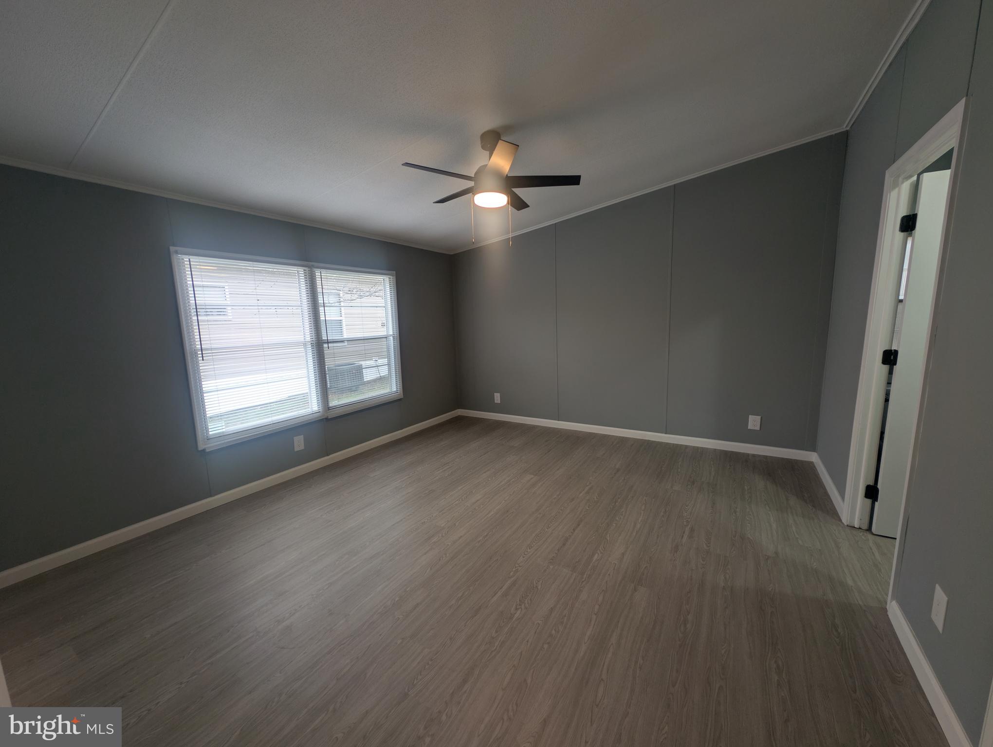 1926 Fletcher Road Aberdeen, MD 21001 - Photo 10 of 15 wooden floor in an empty room with a window