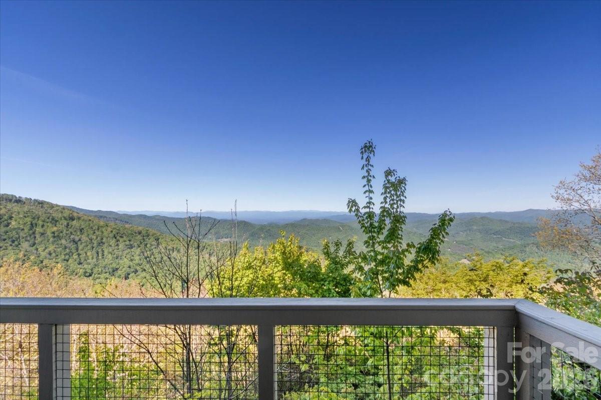 140 Slickrock Road, Unit F4 Burnsville, NC 28714 - Photo 12 of 41 a view of a glass door with a balcony