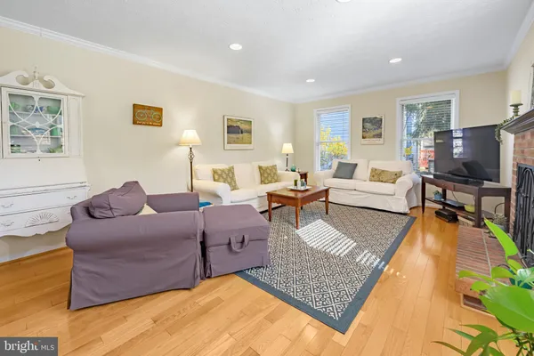 a living room with furniture rug and window