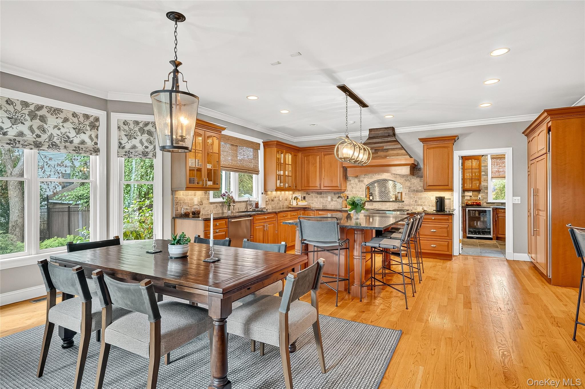 6 Gooler Court Stony Point, NY 10980 - Photo 11 of 50 Dining space with light wood-style floors, crown molding, recessed lighting, and beverage cooler