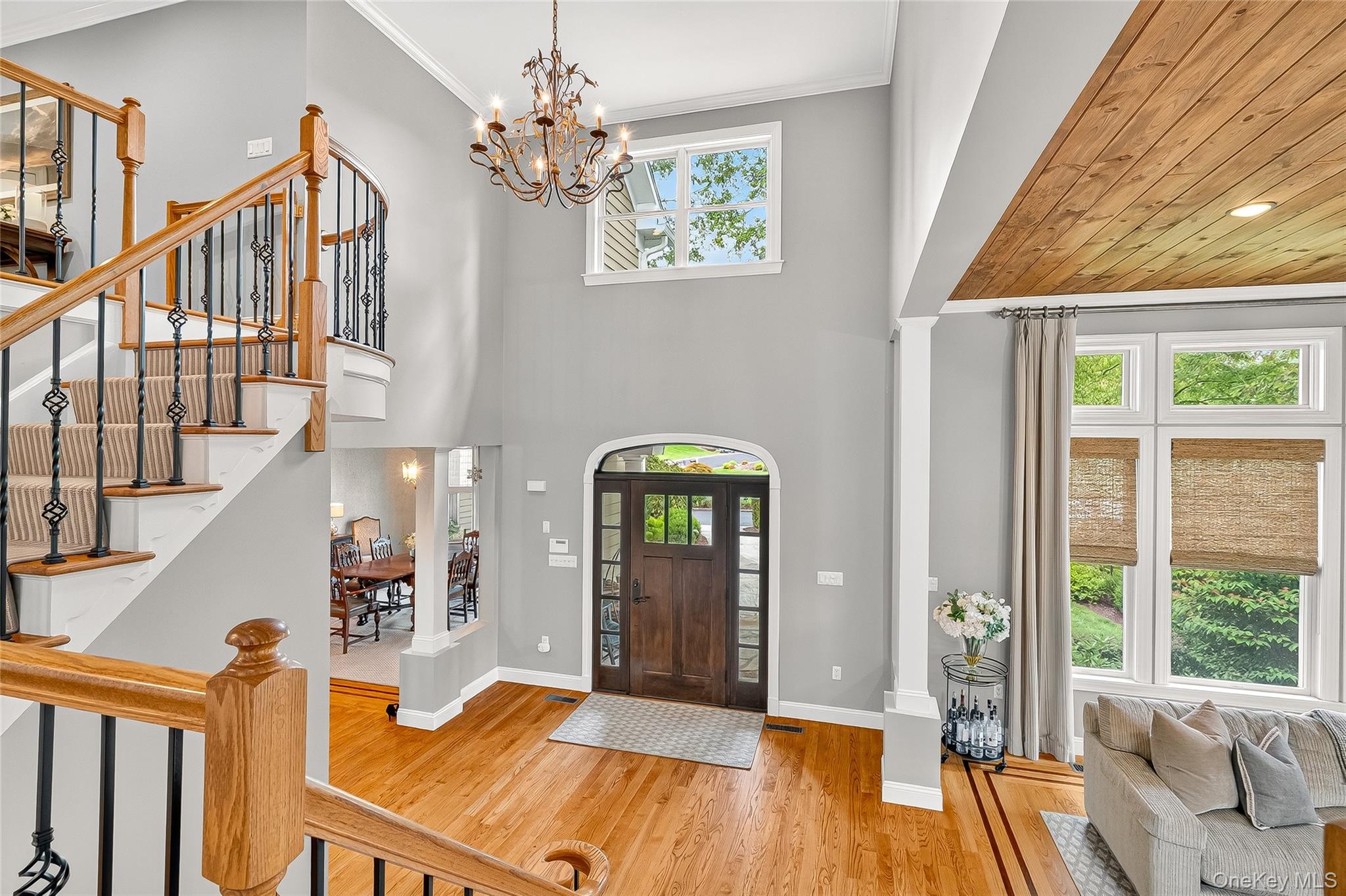 6 Gooler Court Stony Point, NY 10980 - Photo 17 of 50 Entryway featuring wood finished floors, stairs, a chandelier, ornamental molding, and a high ceiling