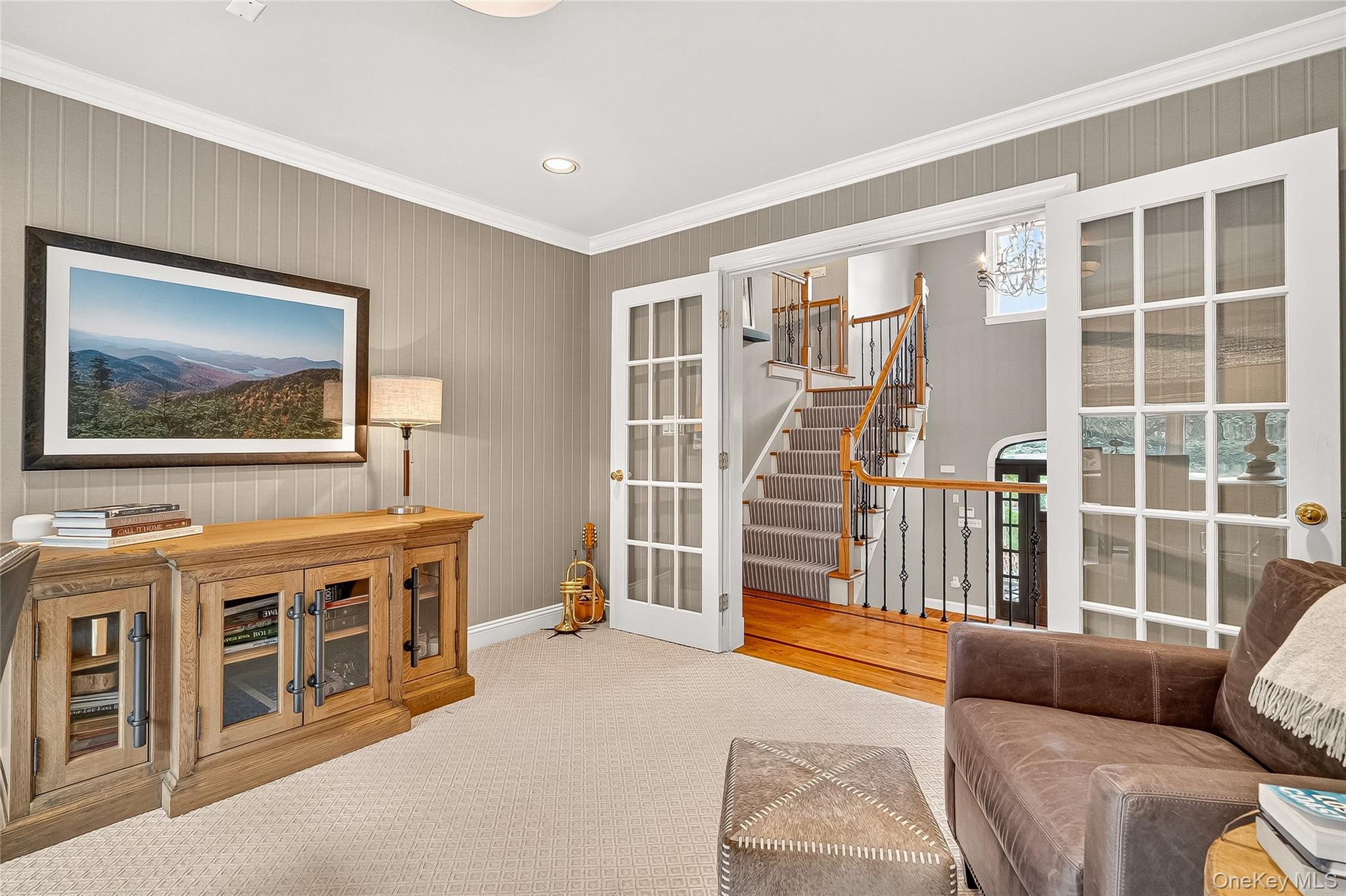6 Gooler Court Stony Point, NY 10980 - Photo 19 of 50 Carpeted living area featuring stairs, crown molding, recessed lighting, french doors, and a chandelier