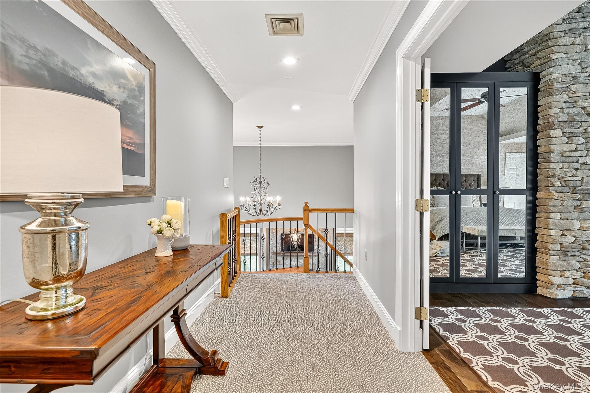 6 Gooler Court Stony Point, NY 10980 - Photo 20 of 50 Hallway with ornamental molding, a chandelier, an upstairs landing, wood finished floors, and recessed lighting