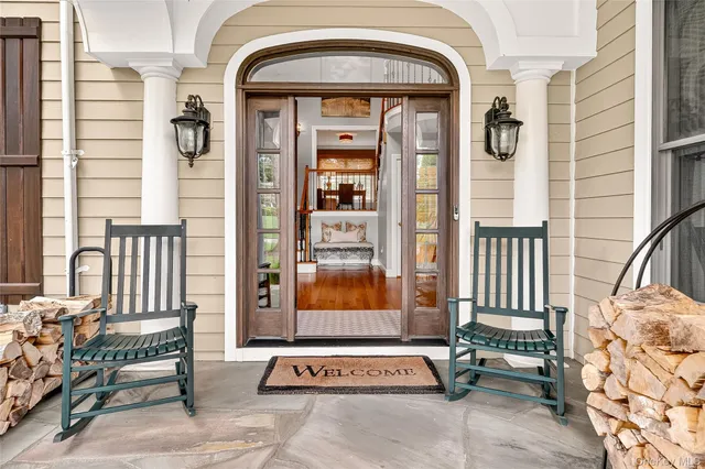 a front view of a house with a outdoor seating