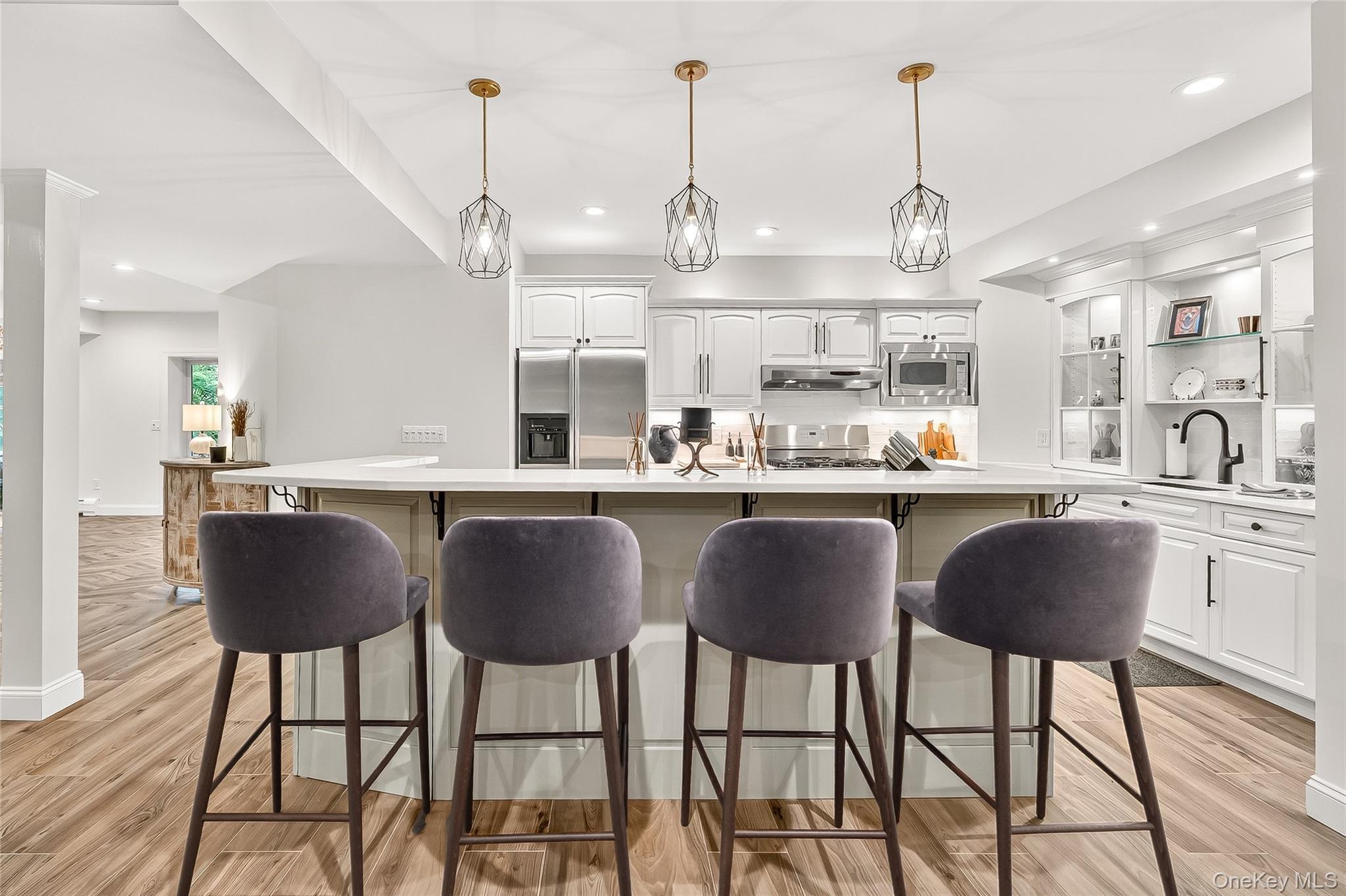 6 Gooler Court Stony Point, NY 10980 - Photo 36 of 50 a kitchen with stainless steel appliances granite countertop a dining table chairs and white cabinets