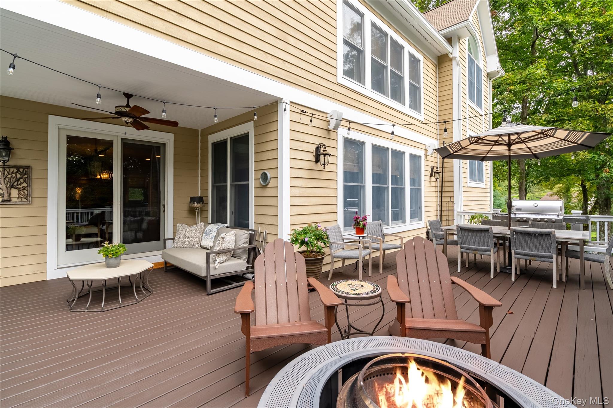 6 Gooler Court Stony Point, NY 10980 - Photo 40 of 50 Wooden terrace featuring outdoor dining area, ceiling fan, and an outdoor living space with a fire pit