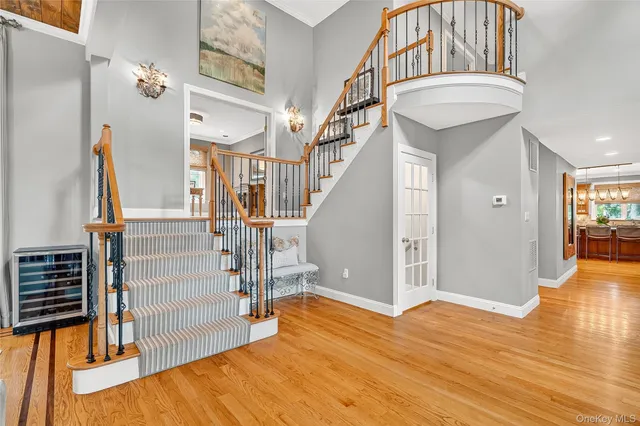 a view of an entryway with wooden floor
