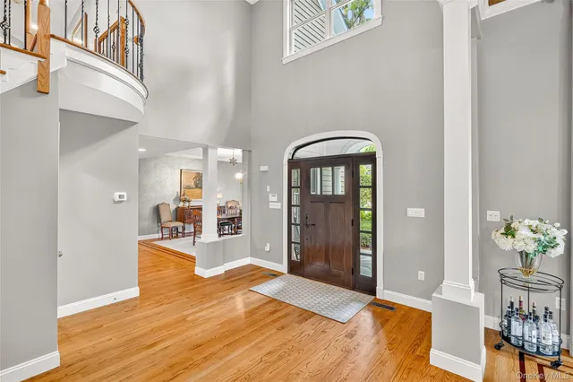 a bedroom with furniture and a wooden floor