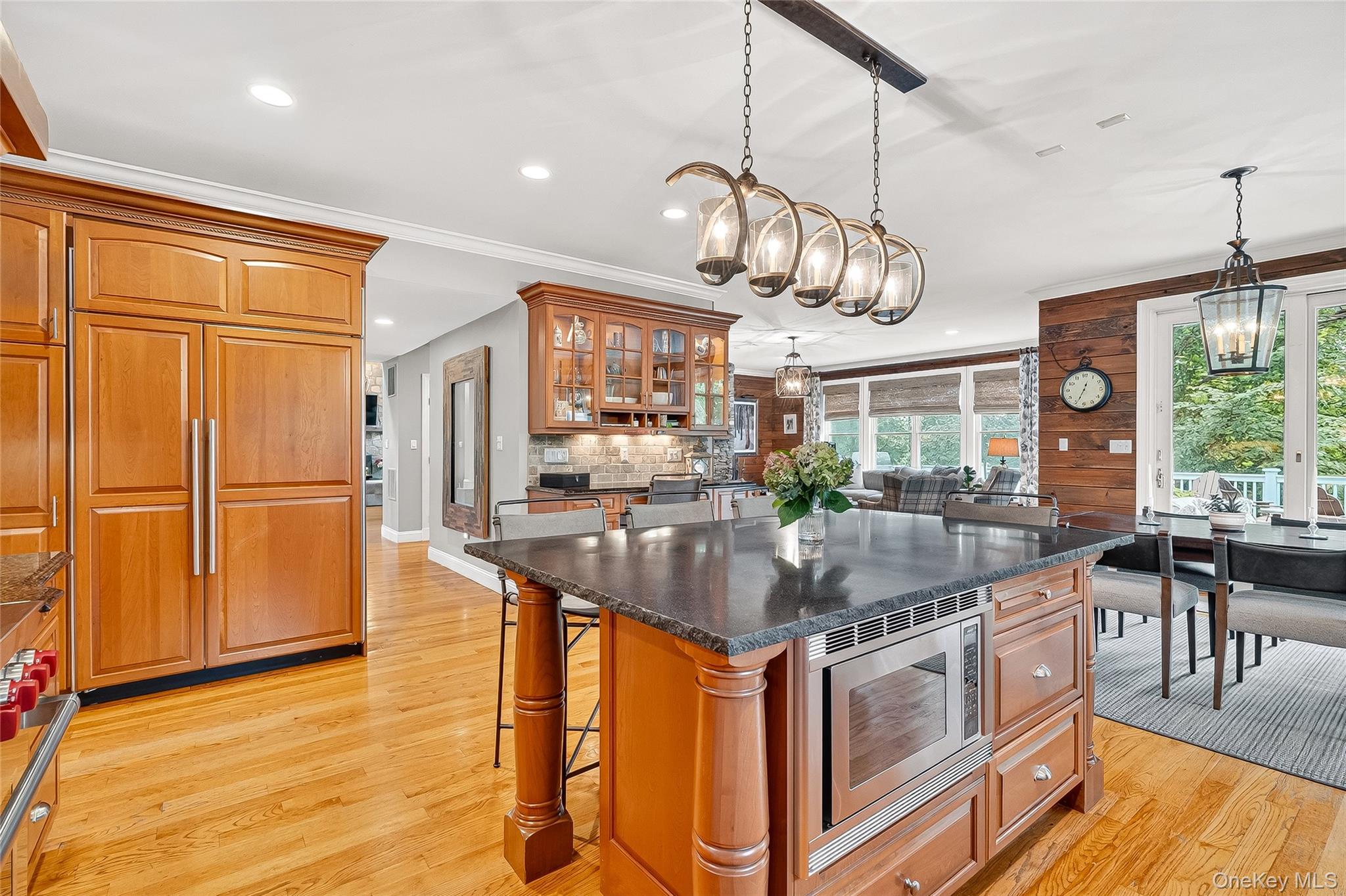 6 Gooler Court Stony Point, NY 10980 - Photo 9 of 50 Kitchen with built in appliances, dark stone counters, a kitchen bar, recessed lighting, and brown cabinetry