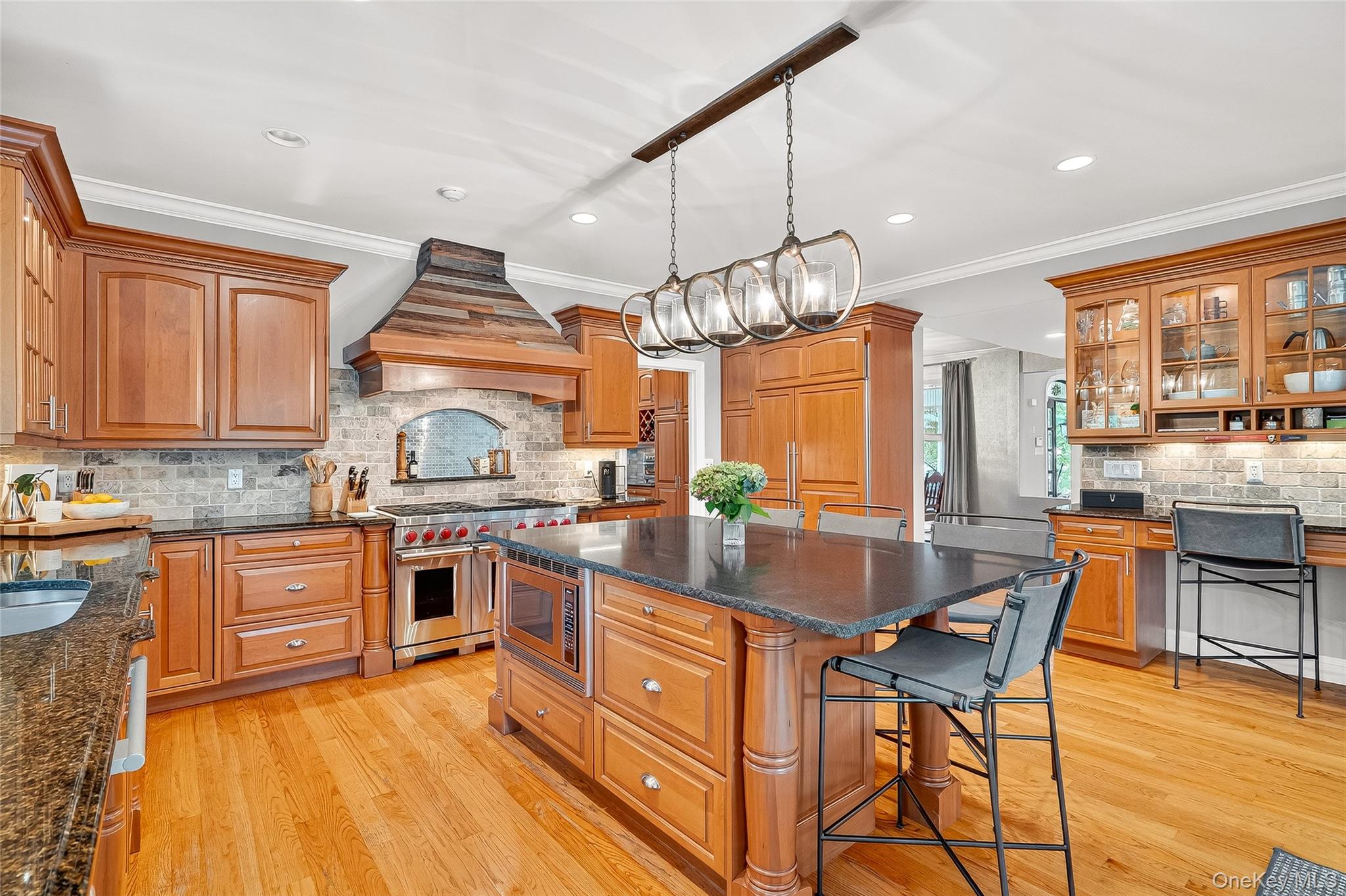 6 Gooler Court Stony Point, NY 10980 - Photo 10 of 50 a kitchen with stainless steel appliances granite countertop wooden cabinets a stove a sink a dining table and chairs