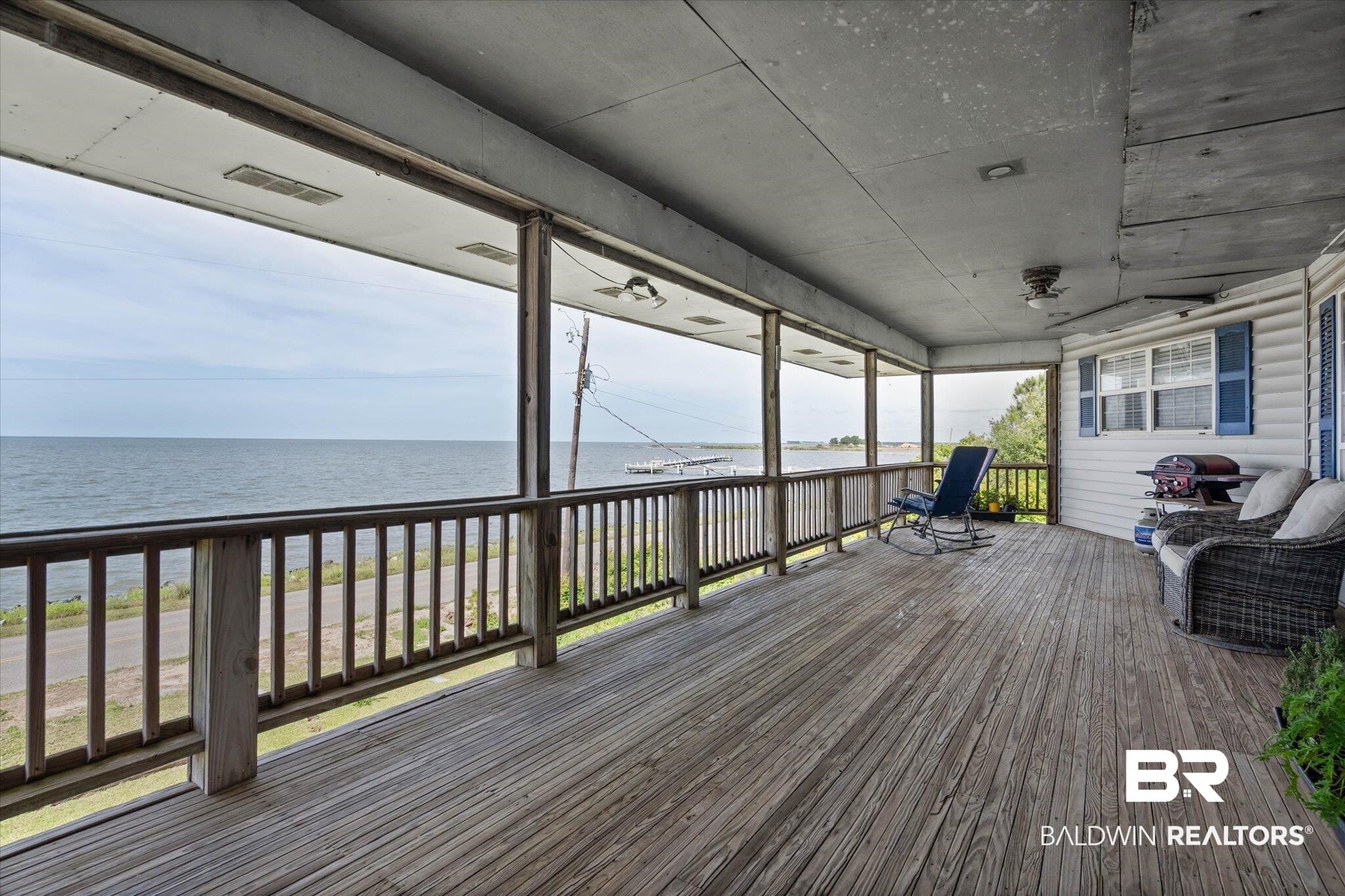 9100 Shell Belt Road Coden, AL 36523 - Photo 4 of 38 Expansive wood deck with a wide-open water view