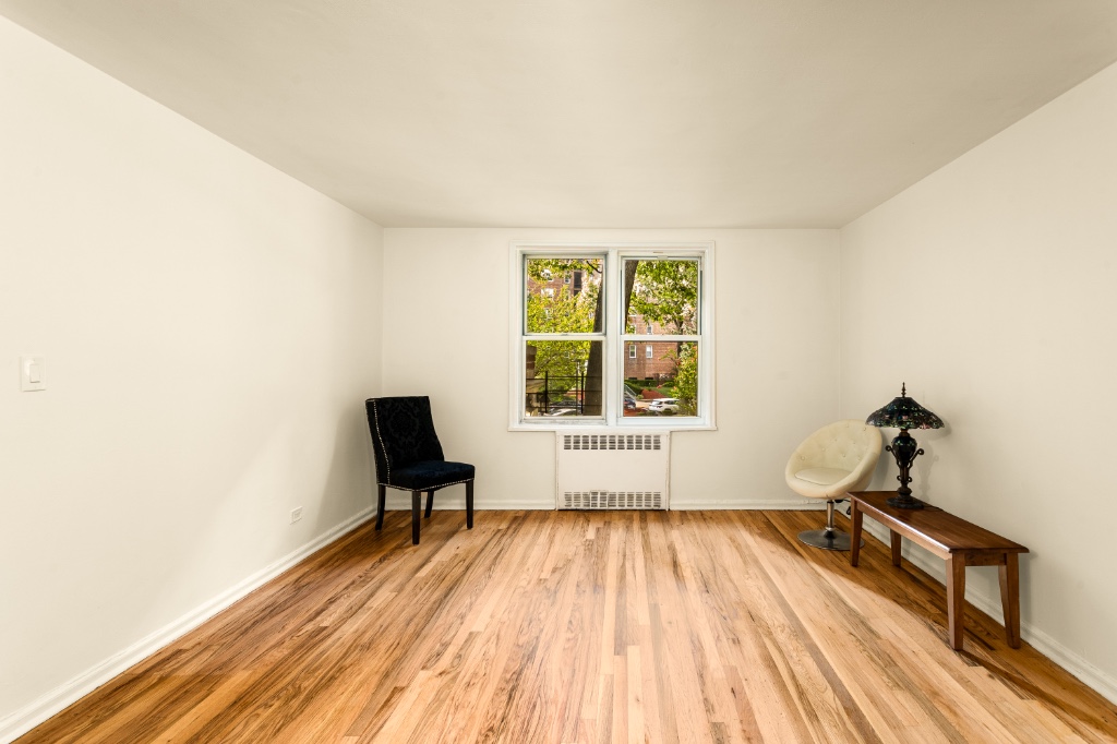 5610 Netherland Avenue, Unit 1G Bronx, NY 10471 - Photo 3 of 17 a view of a room with furniture and wooden floor