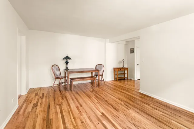 a view of dining room with furniture and wooden floor