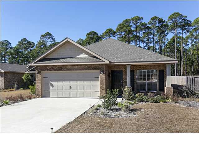 14 Riverbirch Loop Santa Rosa Beach, FL 32459 - Photo 1 of 20 a front view of a house with garden