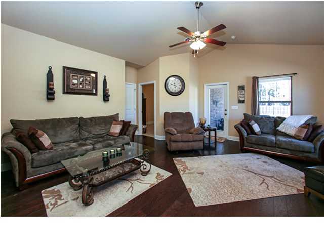 14 Riverbirch Loop Santa Rosa Beach, FL 32459 - Photo 7 of 20 a living room with furniture a ceiling fan and a window