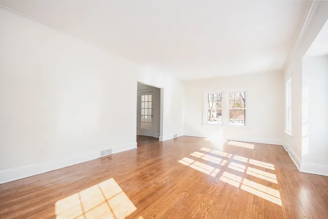 a view of an empty room and window