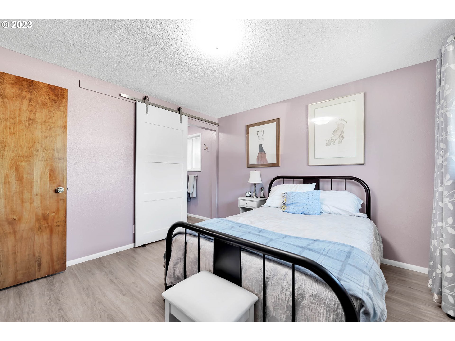576 67th Street Springfield, OR 97478 - Photo 16 of 32 a bedroom with a bed and a table