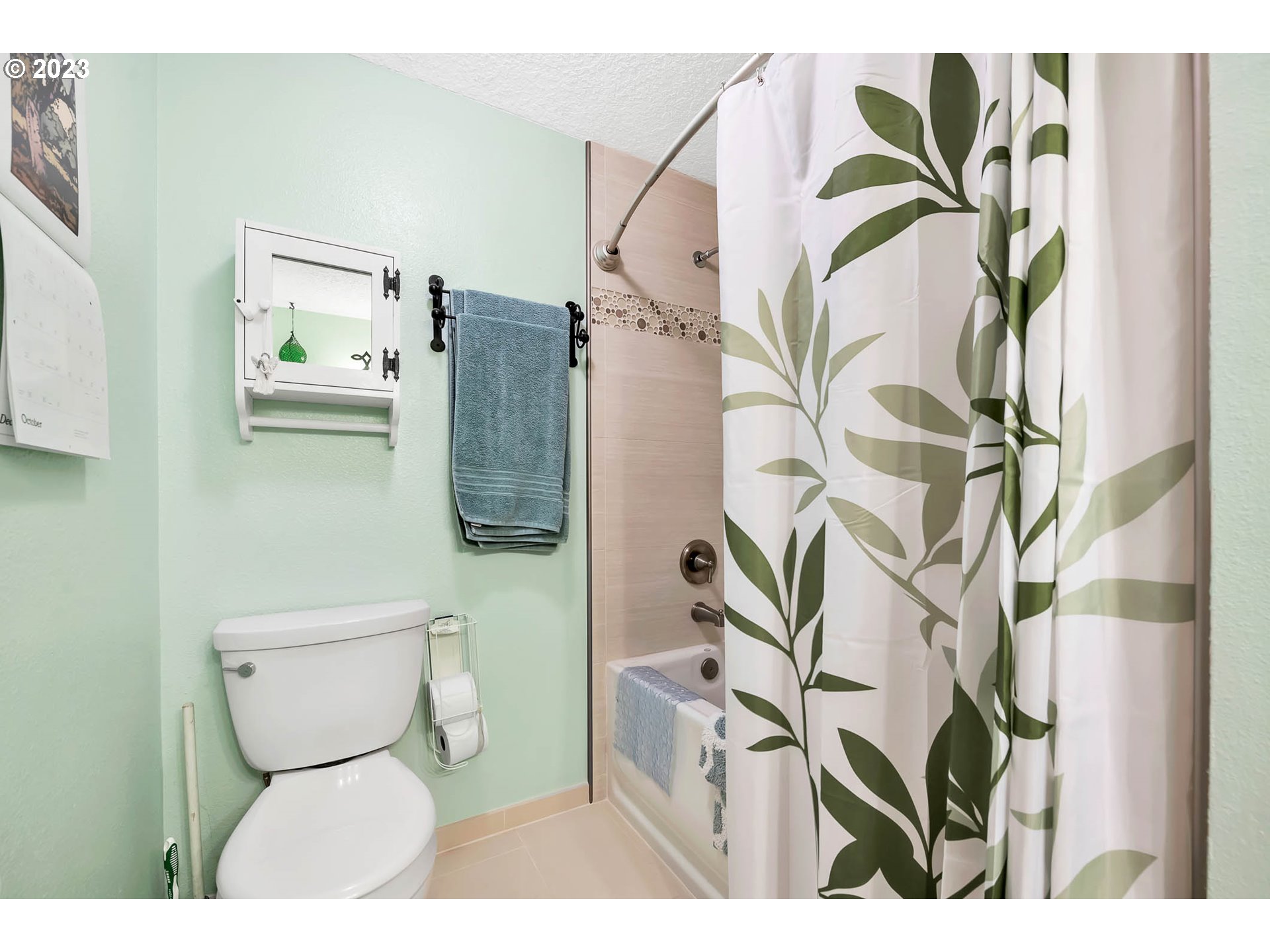 576 67th Street Springfield, OR 97478 - Photo 23 of 32 a bathroom with a toilet and a shower curtain