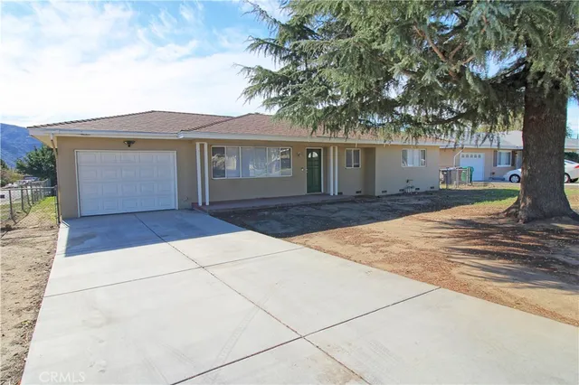 front view of a house with yard