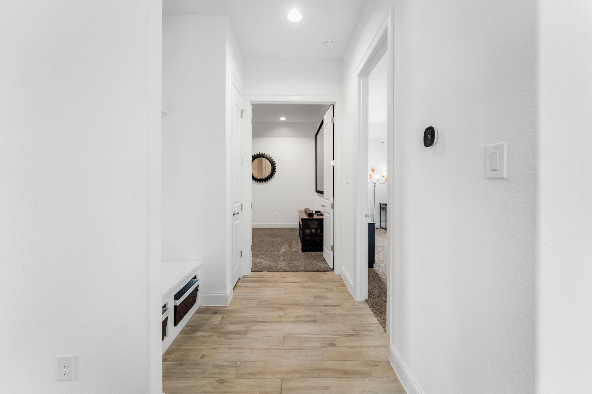 140 Waterloo Cove Georgetown, TX 78628 - Photo 27 of 40 A streamlined corridor boasts rich wood flooring and a mud room!