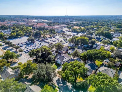 an aerial view of multiple house with a yard