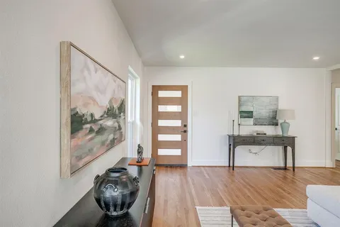 a view of a livingroom with furniture and wooden floor