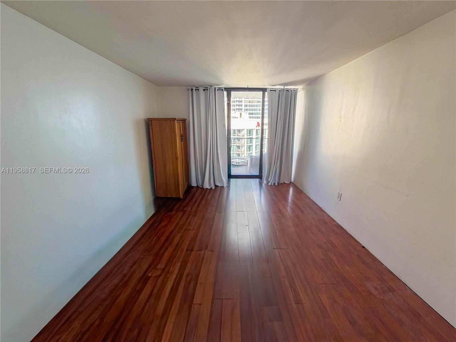 555 Northeast 15th Street, Unit PHF Miami, FL 33132 - Photo 12 of 17 a view of a room with wooden floor and stairs