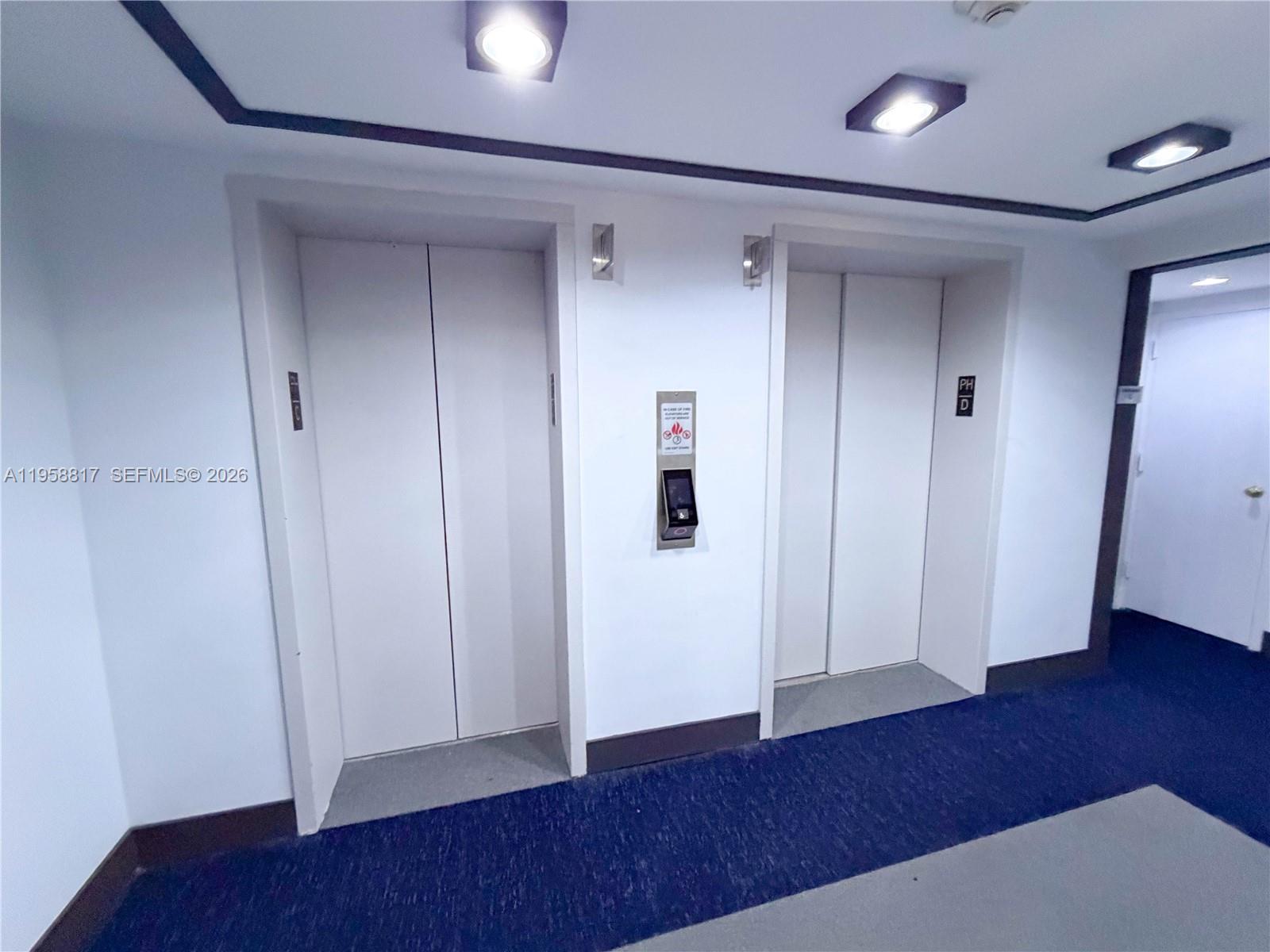 555 Northeast 15th Street, Unit PHF Miami, FL 33132 - Photo 17 of 17 a view of empty room with wooden floor