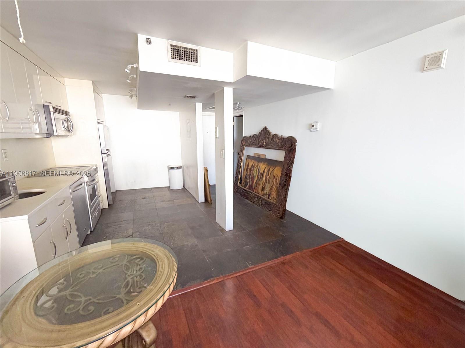 555 Northeast 15th Street, Unit PHF Miami, FL 33132 - Photo 7 of 17 a living room with furniture and a wooden floor