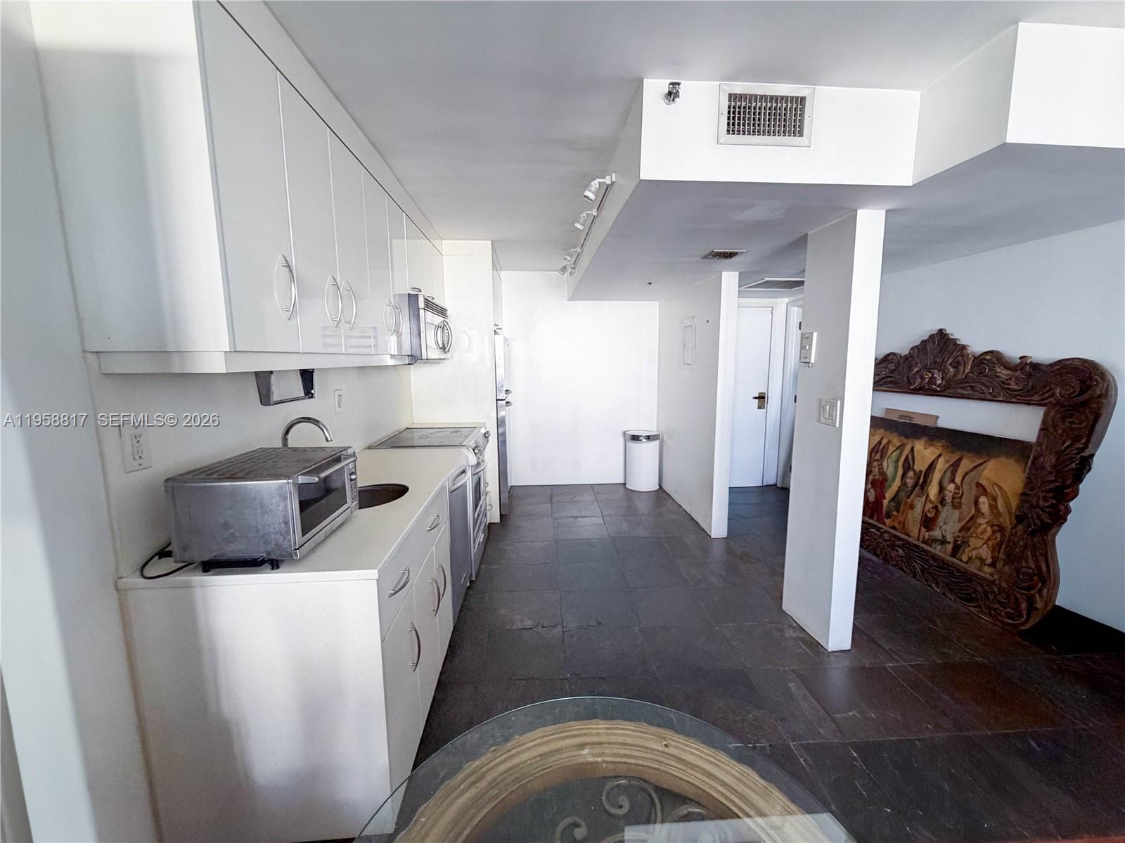 555 Northeast 15th Street, Unit PHF Miami, FL 33132 - Photo 8 of 17 a view of a kitchen with electric appliances