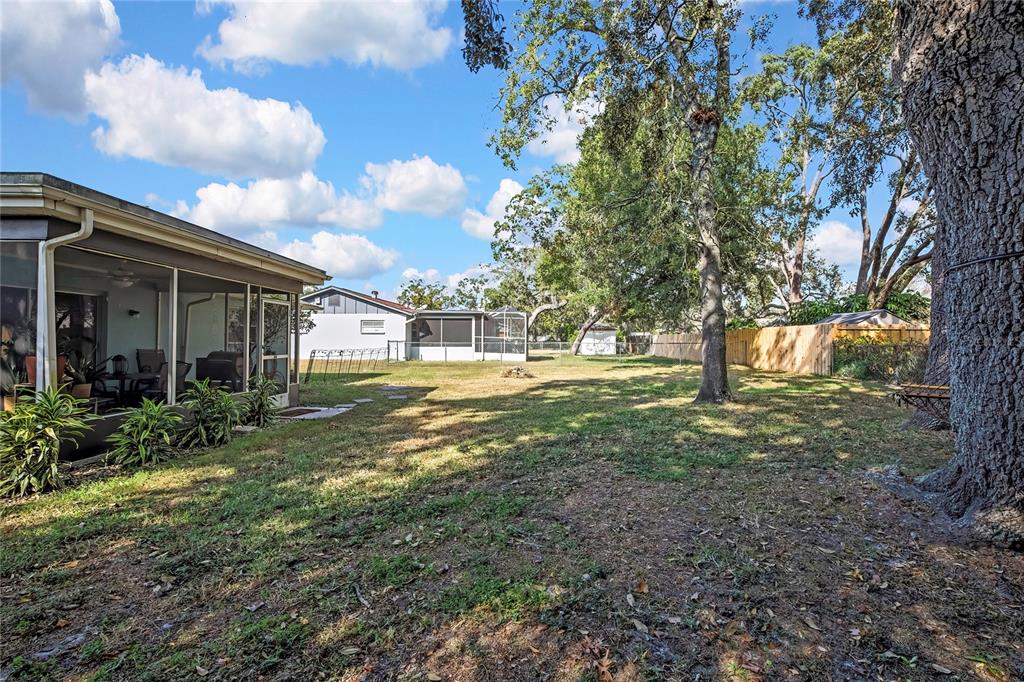 368 Portland Avenue Spring Hill, FL 34606 - Photo 16 of 38 a view of a house with backyard and trees
