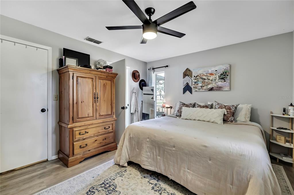 368 Portland Avenue Spring Hill, FL 34606 - Photo 32 of 38 a bedroom with a bed dresser and a window