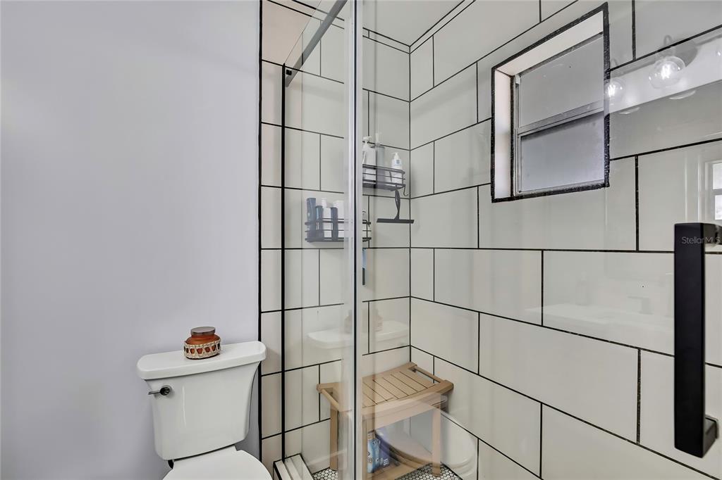 368 Portland Avenue Spring Hill, FL 34606 - Photo 34 of 38 a bathroom with a sink and mirror