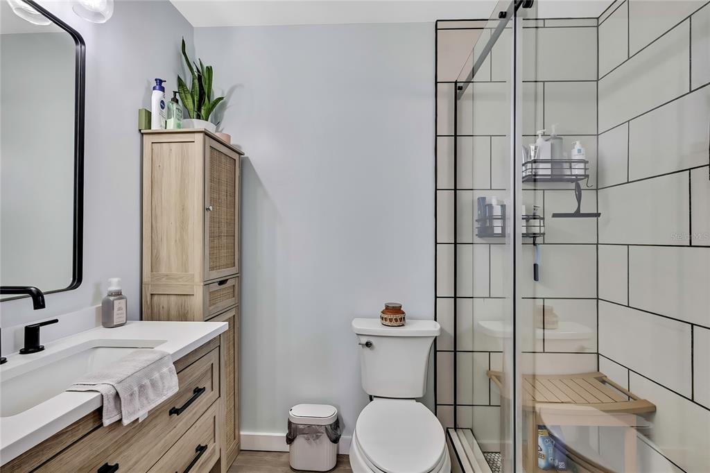 368 Portland Avenue Spring Hill, FL 34606 - Photo 35 of 38 a bathroom with a sink toilet and shower