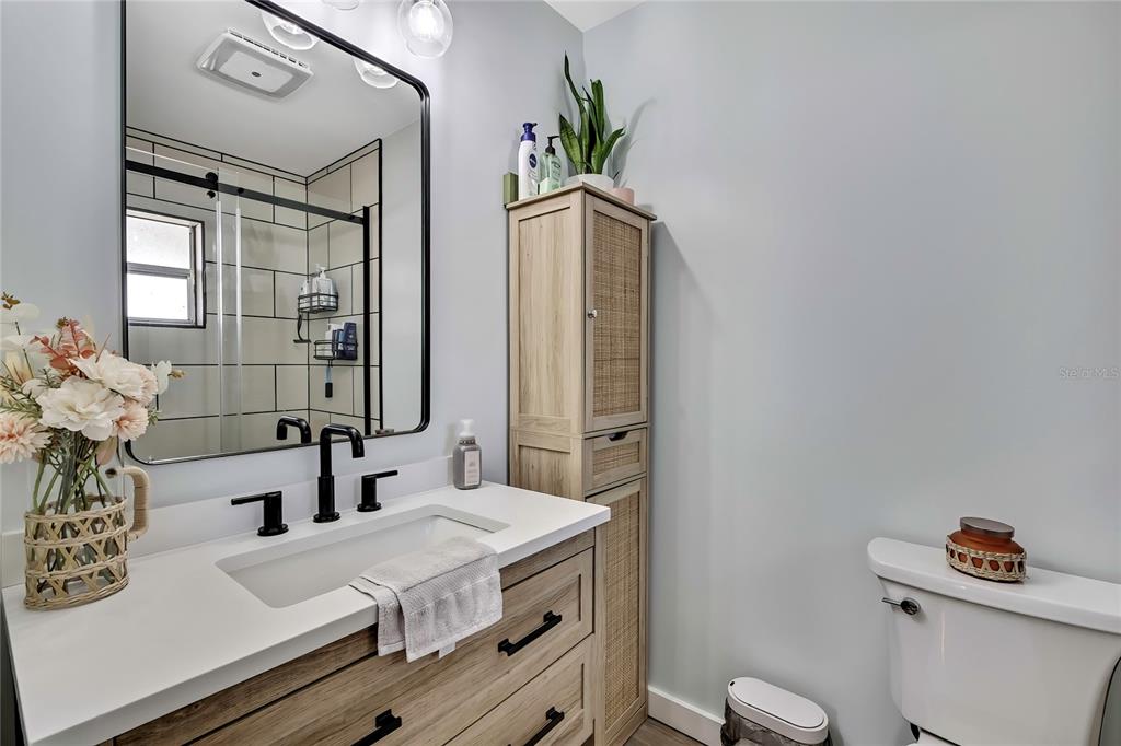 368 Portland Avenue Spring Hill, FL 34606 - Photo 36 of 38 a bathroom with a sink a toilet and shower