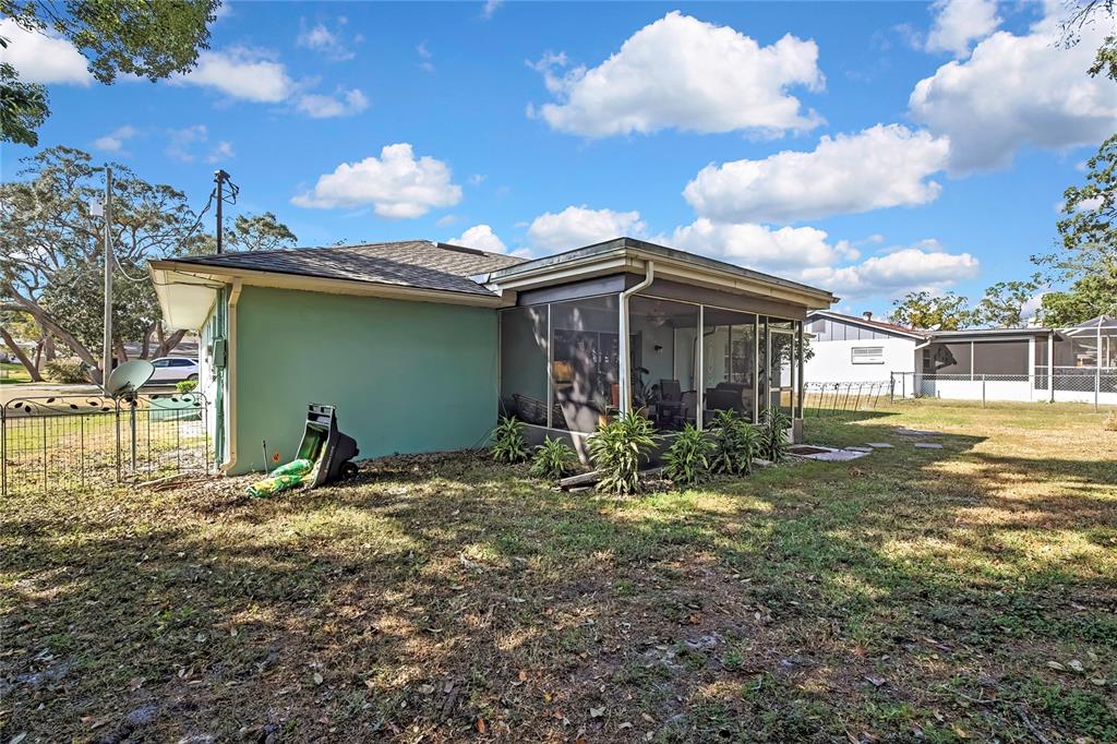 368 Portland Avenue Spring Hill, FL 34606 - Photo 8 of 38 a backyard of a house with table and chairs