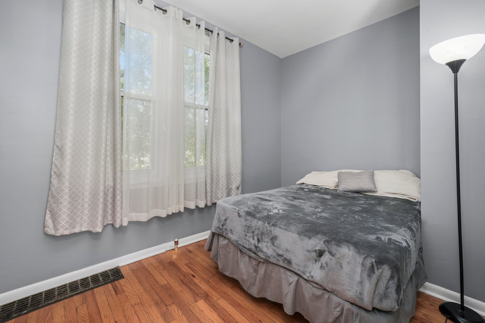 5648 Hawthorne Avenue Berkeley, IL 60163 - Photo 14 of 25 a bedroom with a bed and a walk in closet