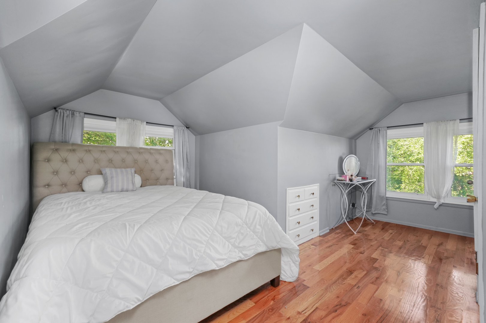 5648 Hawthorne Avenue Berkeley, IL 60163 - Photo 16 of 25 a bedroom with a bed and a large window