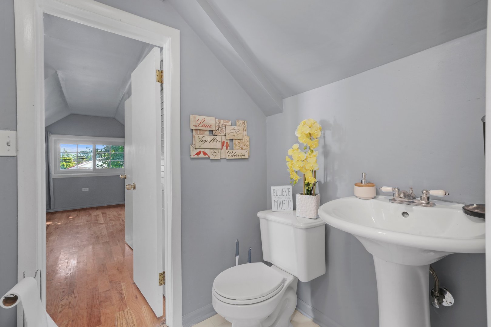 5648 Hawthorne Avenue Berkeley, IL 60163 - Photo 18 of 25 a bathroom with a sink and mirror with toilet
