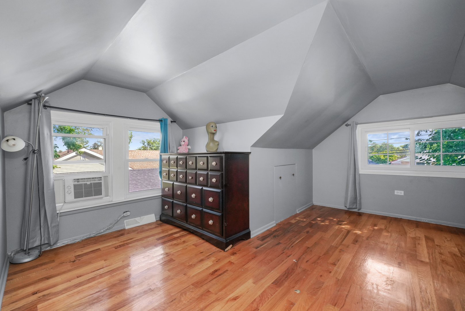 5648 Hawthorne Avenue Berkeley, IL 60163 - Photo 19 of 25 wooden floor in an empty room with a window
