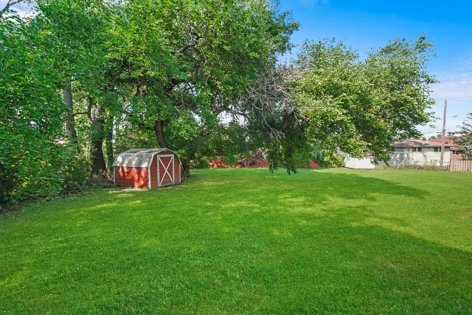 5648 Hawthorne Avenue Berkeley, IL 60163 - Photo 24 of 25 a view of a park with large trees